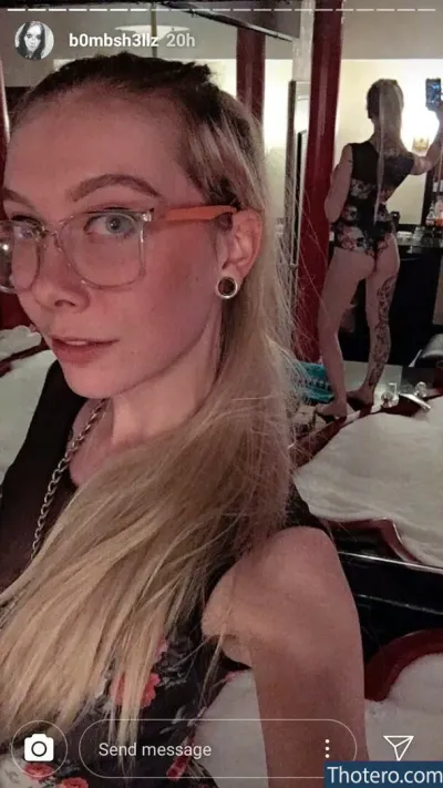 b0mbsh3llz - blond woman with glasses taking selfie in mirror with mirror in background