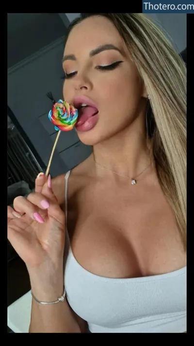babyannaxx - with a big breast is eating a lollipop