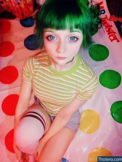 lunadlight - girl with green hair sitting on a polka dot bed