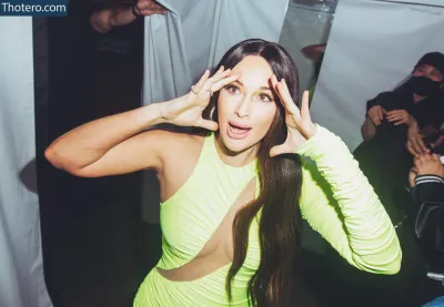Kacey Musgraves - woman in a lime dress making a funny face