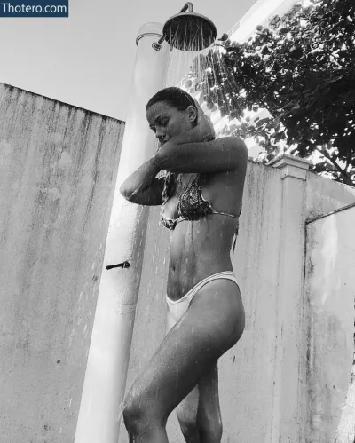 Pâmela Tomé - woman in a bikini standing under a shower head