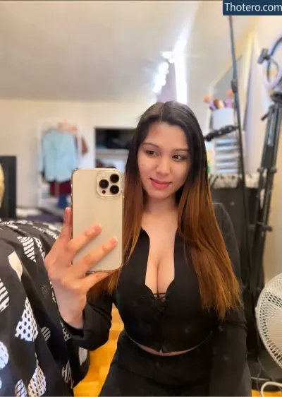Sabrina Chelsiee Cargo - woman taking a selfie in a black top and black pants