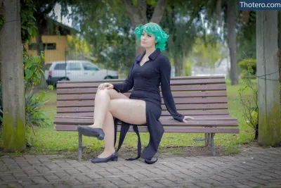 Patripopes - there is a woman with green hair sitting on a bench