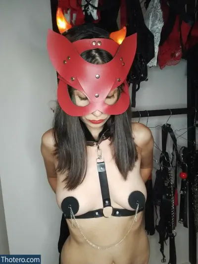 Kübra Yurdakul - woman wearing a red leather mask with red horns