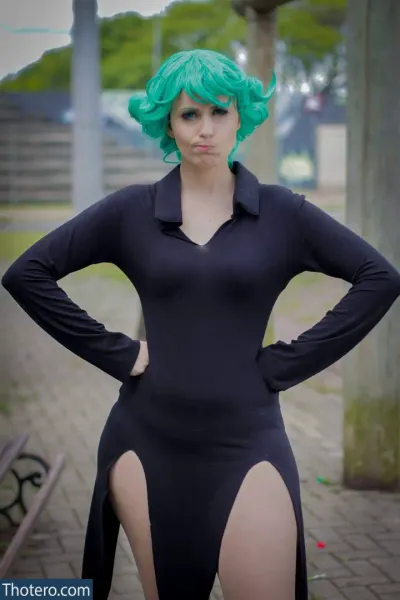 Patripopes - in a black bodysuit with green hair and a green wig