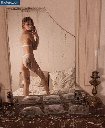 Emyjolie_ - there is a woman in a white bikini taking a picture of herself in a mirror