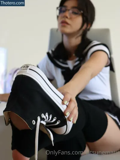 adestoex - sitting on a chair with a pair of shoes on her feet